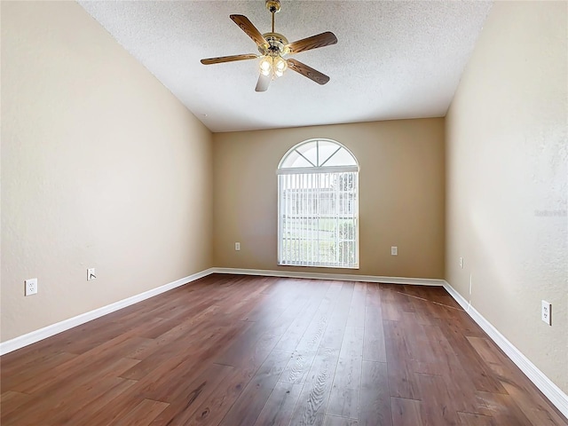 spare room featuring ceiling fan, wood-type flooring, and a textured ceiling