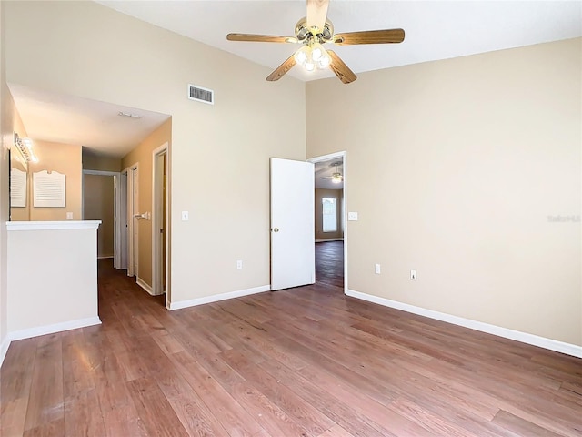 empty room featuring ceiling fan and wood-type flooring