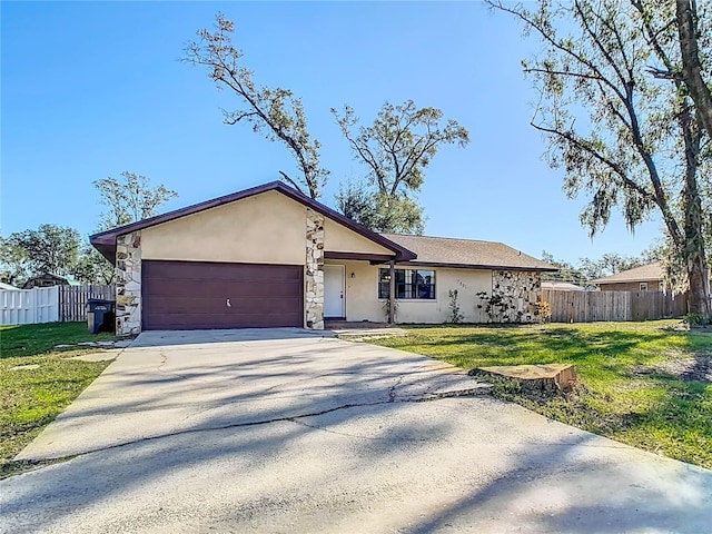 ranch-style house with a front yard and a garage