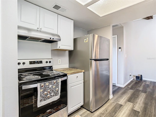 kitchen with white cabinetry, stainless steel appliances, and wood-type flooring