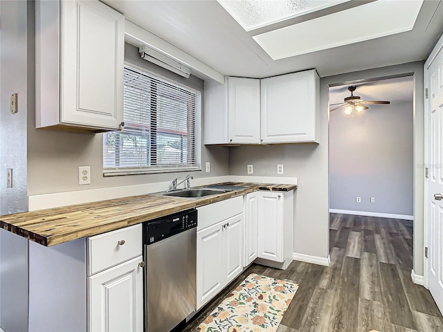 kitchen with ceiling fan, sink, dishwasher, white cabinetry, and butcher block counters