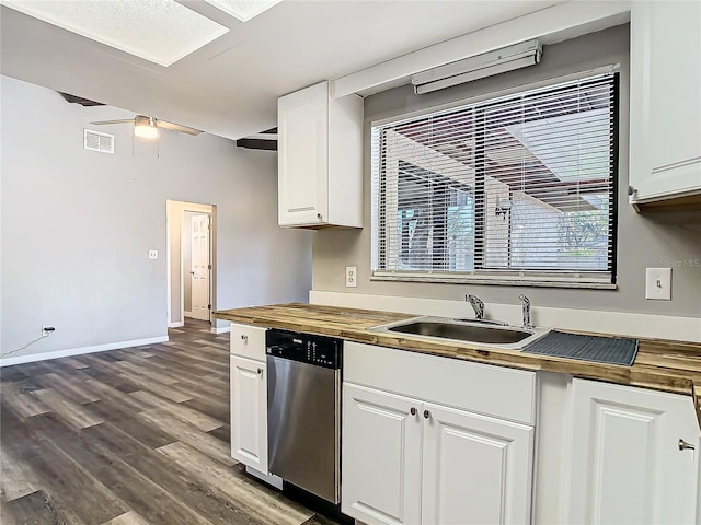 kitchen featuring white cabinetry, stainless steel dishwasher, and butcher block counters