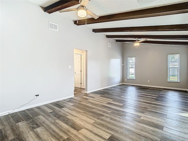 unfurnished room featuring beamed ceiling, a textured ceiling, dark hardwood / wood-style flooring, and ceiling fan