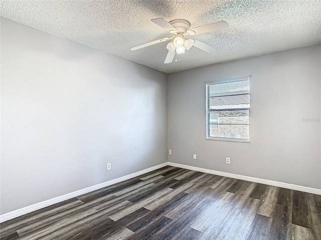 unfurnished room featuring a textured ceiling, dark hardwood / wood-style floors, and ceiling fan