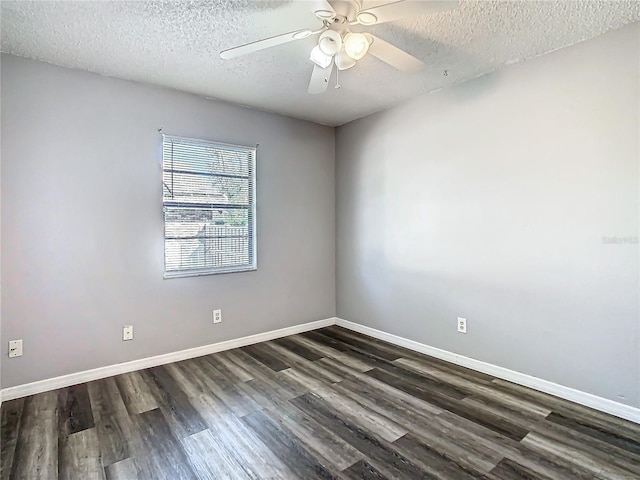 unfurnished room featuring ceiling fan, dark wood-type flooring, and a textured ceiling