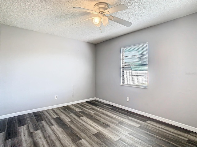 empty room featuring a textured ceiling, dark hardwood / wood-style floors, and ceiling fan