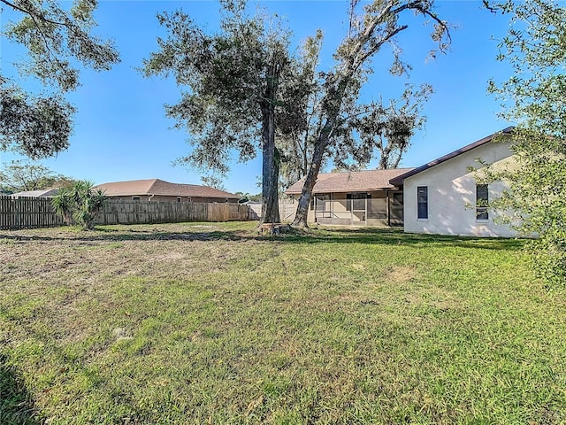 view of yard with a sunroom