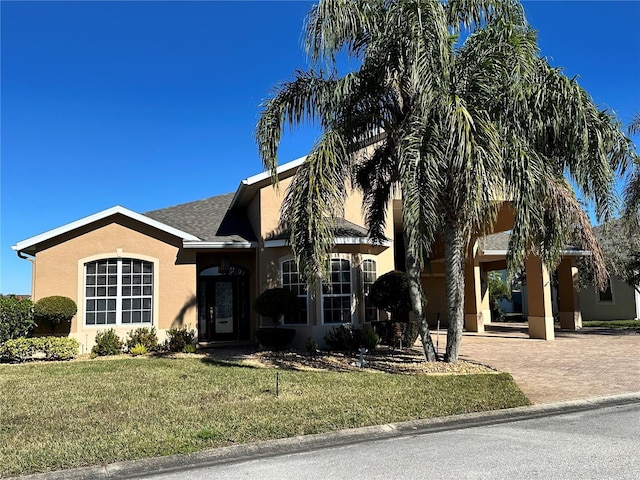 ranch-style home featuring a front yard