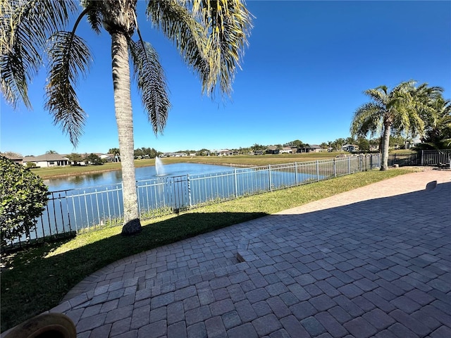 view of patio with a water view