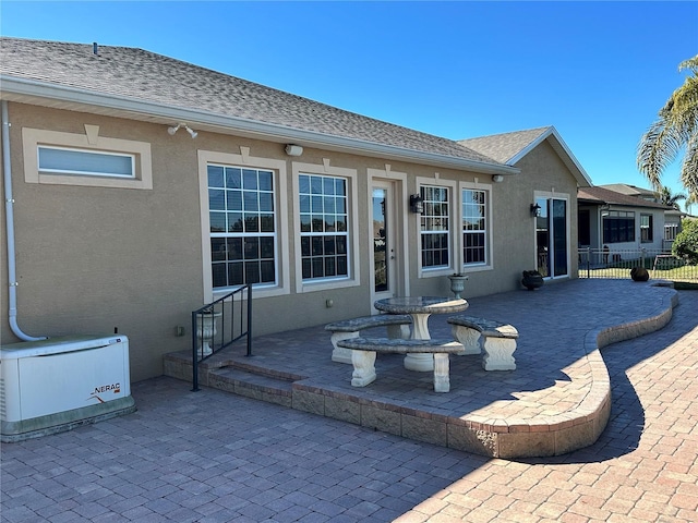 back of property with a patio area