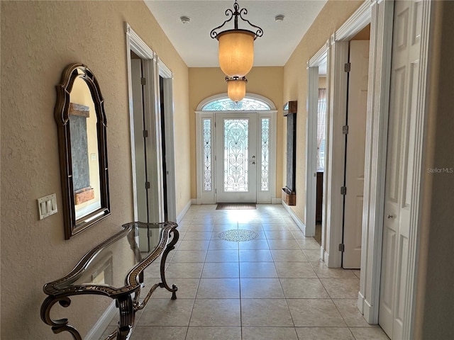 entryway featuring light tile patterned floors