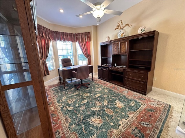 tiled office space featuring ceiling fan