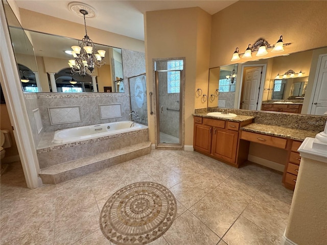 bathroom featuring plus walk in shower, vanity, an inviting chandelier, and tile patterned floors