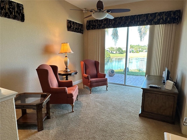 living area featuring ceiling fan and light colored carpet