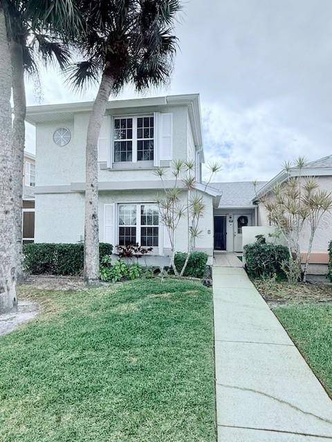 view of front of home with a front yard