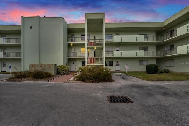 view of outdoor building at dusk