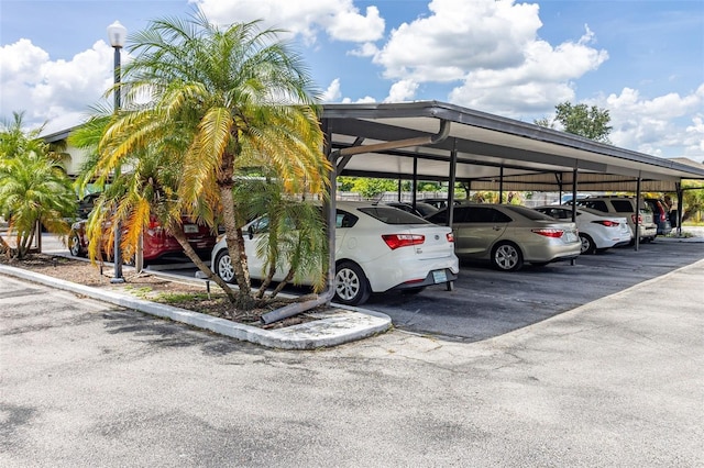 view of parking / parking lot with a carport