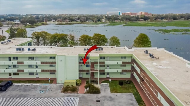 birds eye view of property with a water view