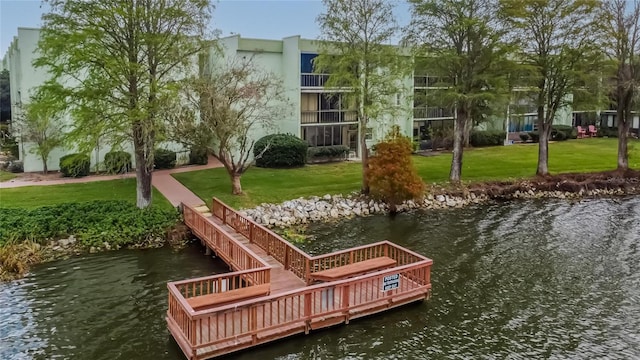 dock area featuring a yard and a water view