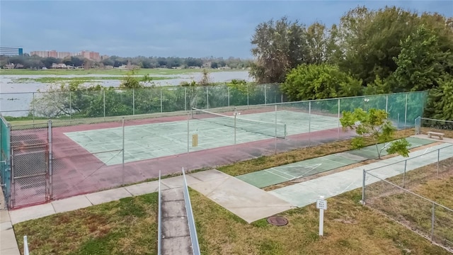 view of tennis court with shuffleboard and fence