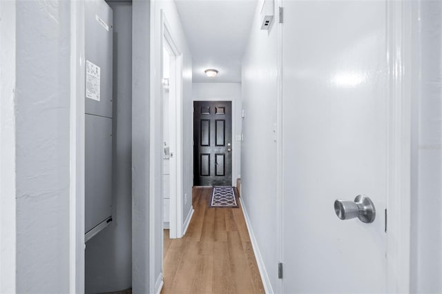 hall with light wood-type flooring