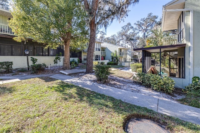 view of yard featuring a sunroom