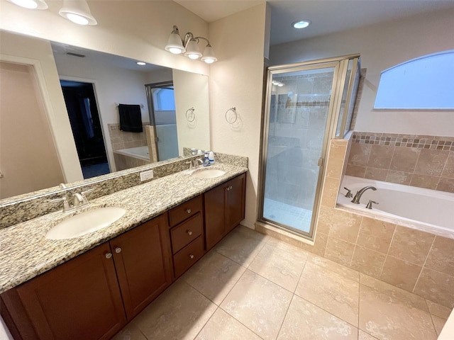 bathroom featuring vanity, tile patterned flooring, and independent shower and bath