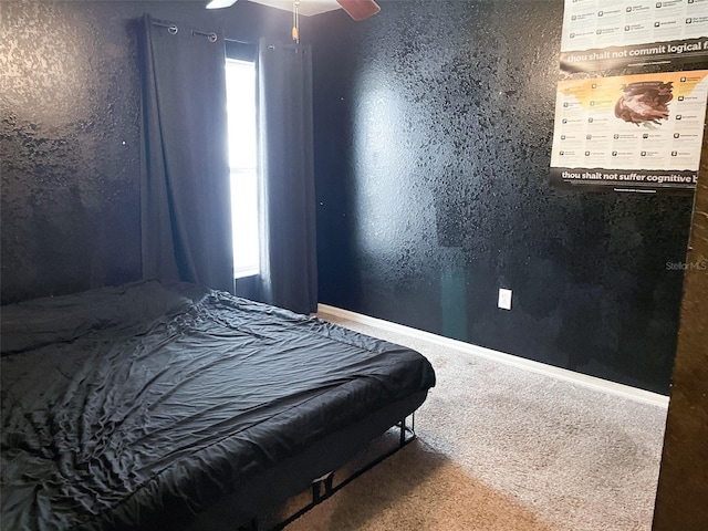 bedroom with ceiling fan and carpet flooring