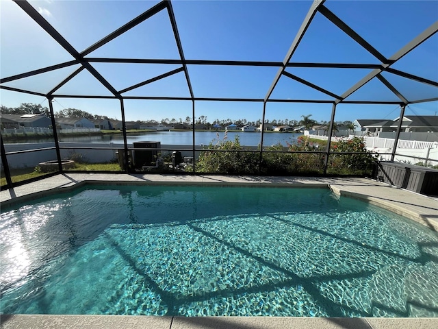 outdoor pool with a water view, a residential view, a lanai, and a patio