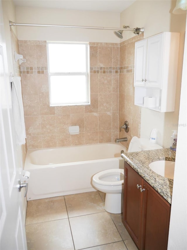 bathroom with toilet, shower / washtub combination, tile patterned flooring, and vanity