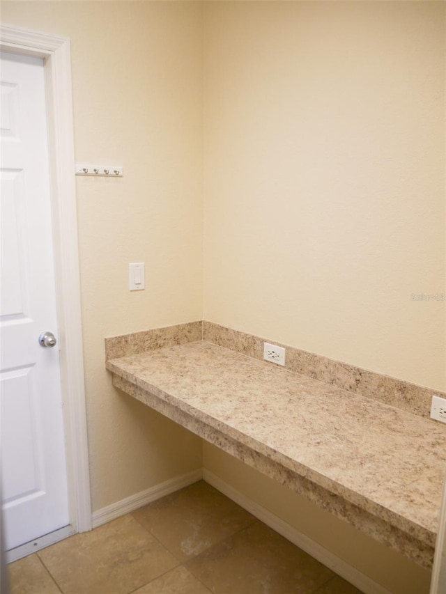 bathroom featuring tile patterned floors and baseboards