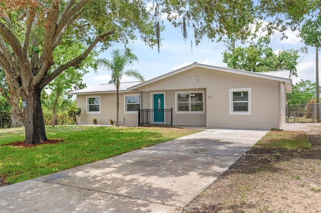 single story home with a front yard