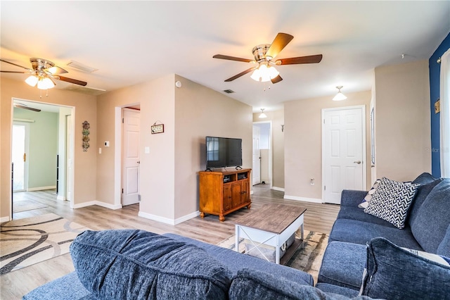 living room featuring light wood-type flooring and ceiling fan