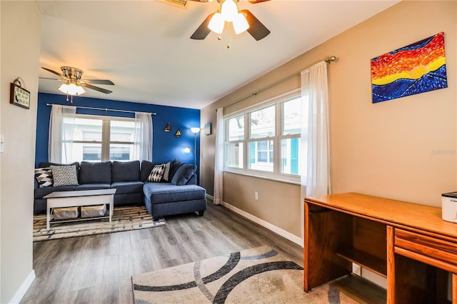 living room with ceiling fan and hardwood / wood-style floors