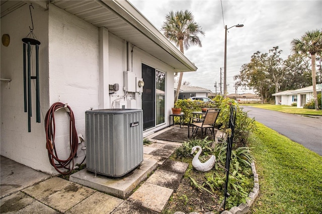 view of property exterior with central AC unit