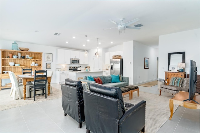 living room with ceiling fan and light tile patterned floors