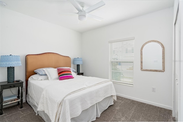 bedroom with dark carpet and ceiling fan