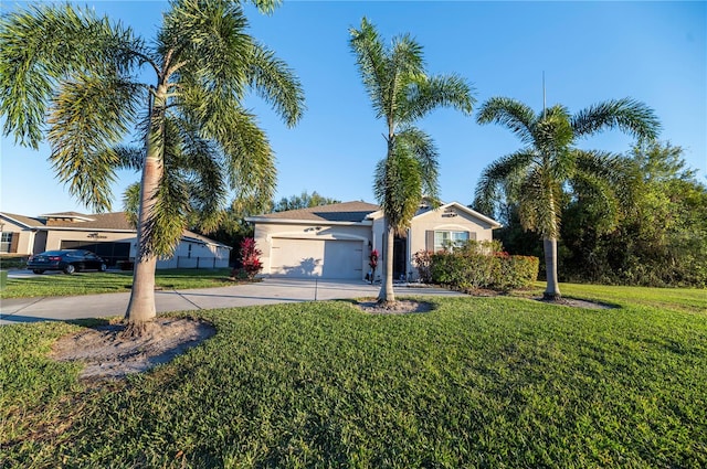 ranch-style home featuring a garage and a front lawn