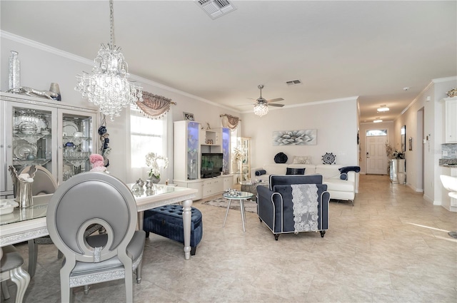 living room with ceiling fan with notable chandelier and ornamental molding