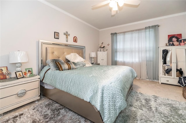 carpeted bedroom featuring ceiling fan and ornamental molding