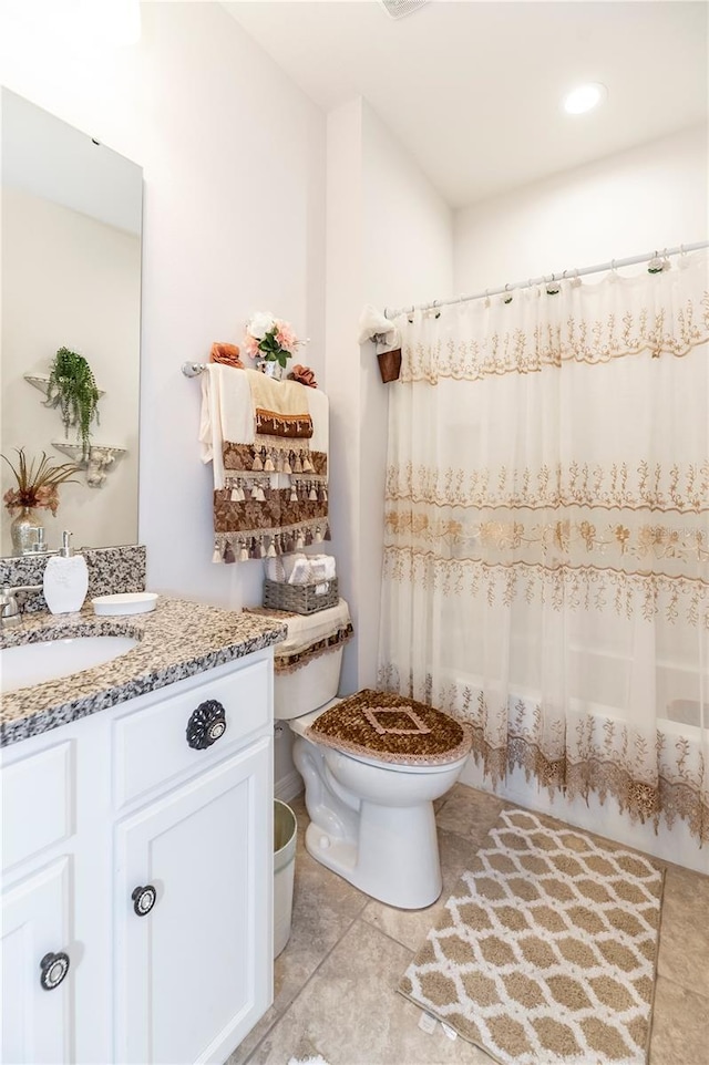 full bathroom with vanity, shower / bath combination with curtain, and toilet