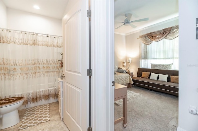 bathroom with shower / bathtub combination with curtain, toilet, and ceiling fan