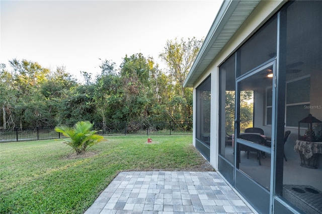 view of yard with a patio and a sunroom