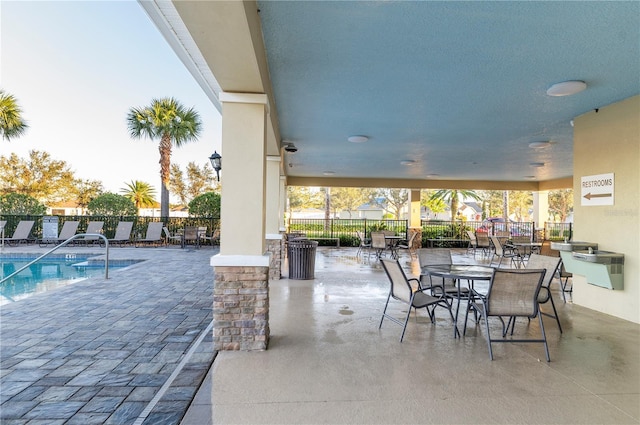 view of patio featuring a community pool