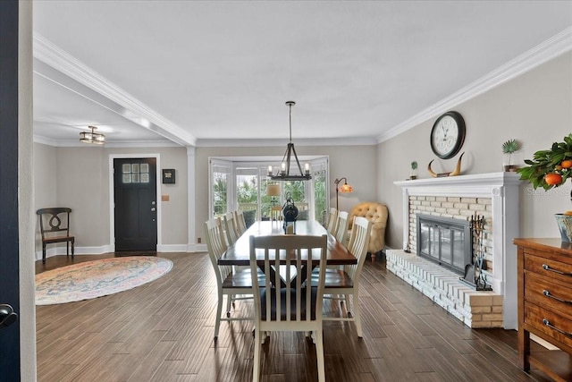 dining space with a fireplace, dark hardwood / wood-style floors, and crown molding