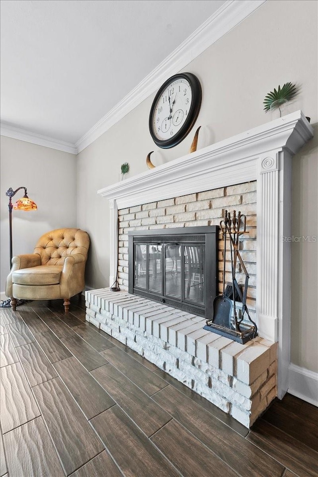 interior details featuring crown molding and a brick fireplace