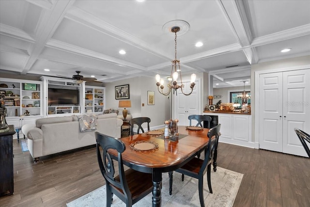 dining area with beam ceiling, dark hardwood / wood-style flooring, ceiling fan with notable chandelier, and coffered ceiling