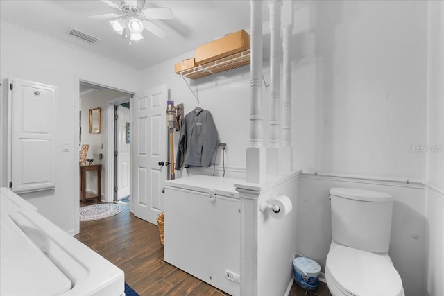 bathroom featuring ceiling fan and toilet