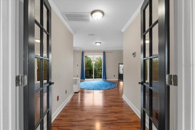 corridor featuring dark wood-type flooring and ornamental molding