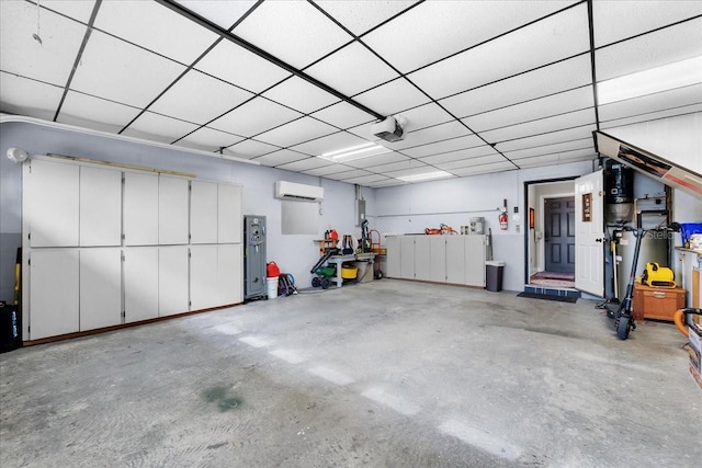 garage featuring a garage door opener and a wall mounted AC